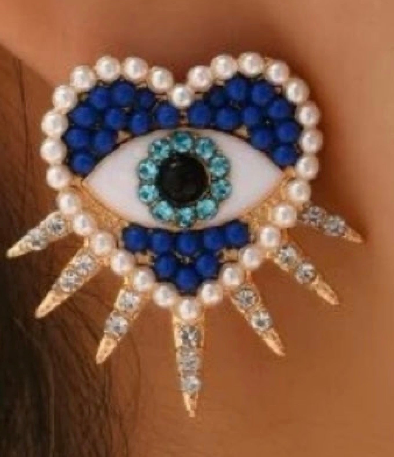 Boucles d’oreilles œil protecteur